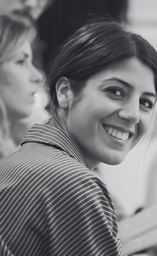A smiling healthcare professional in conversation